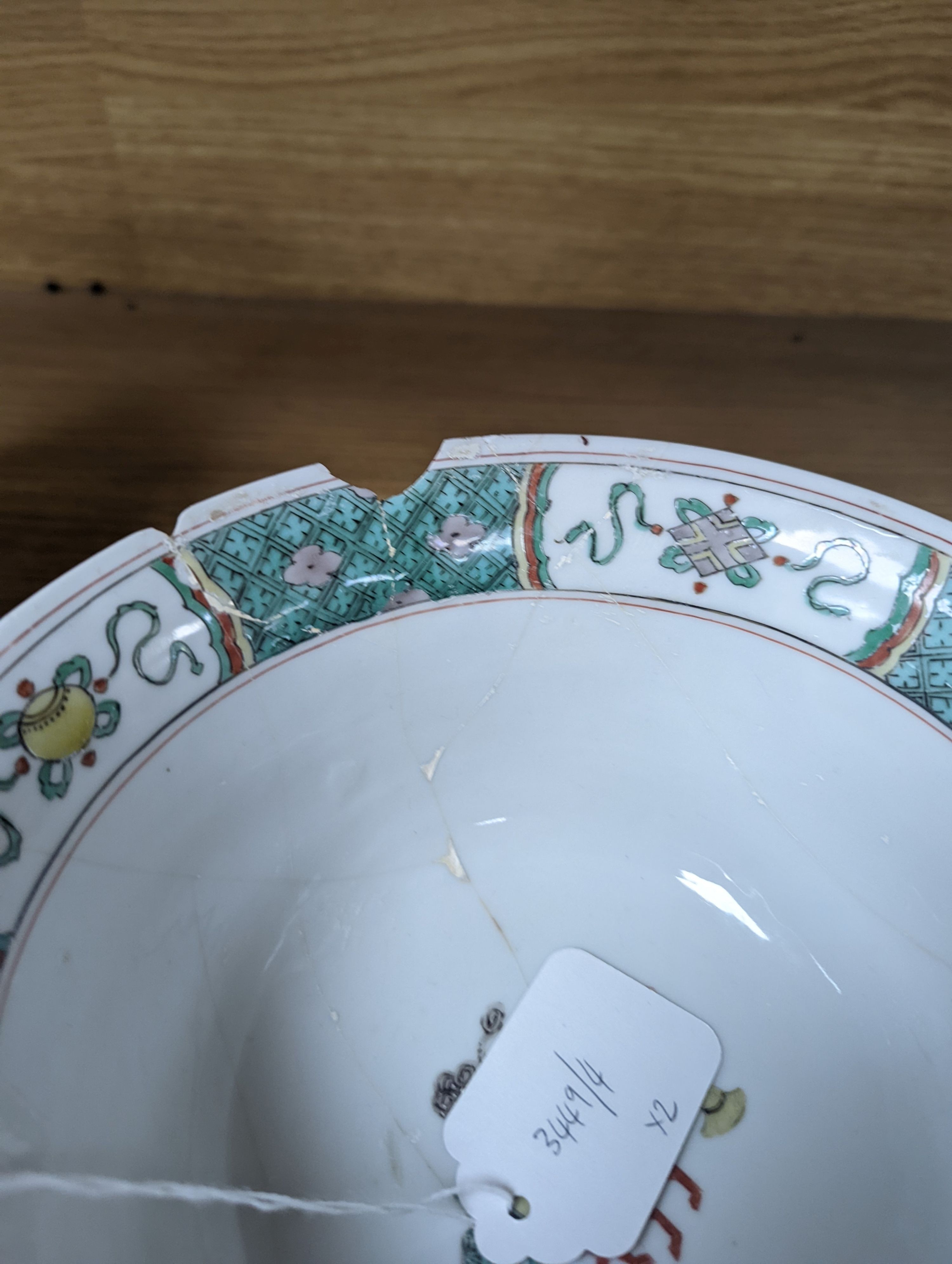 A Kangxi famille verte bowl, 20cm (a.f.) and a Chinese Dowager Empress-pattern pillow with dragons